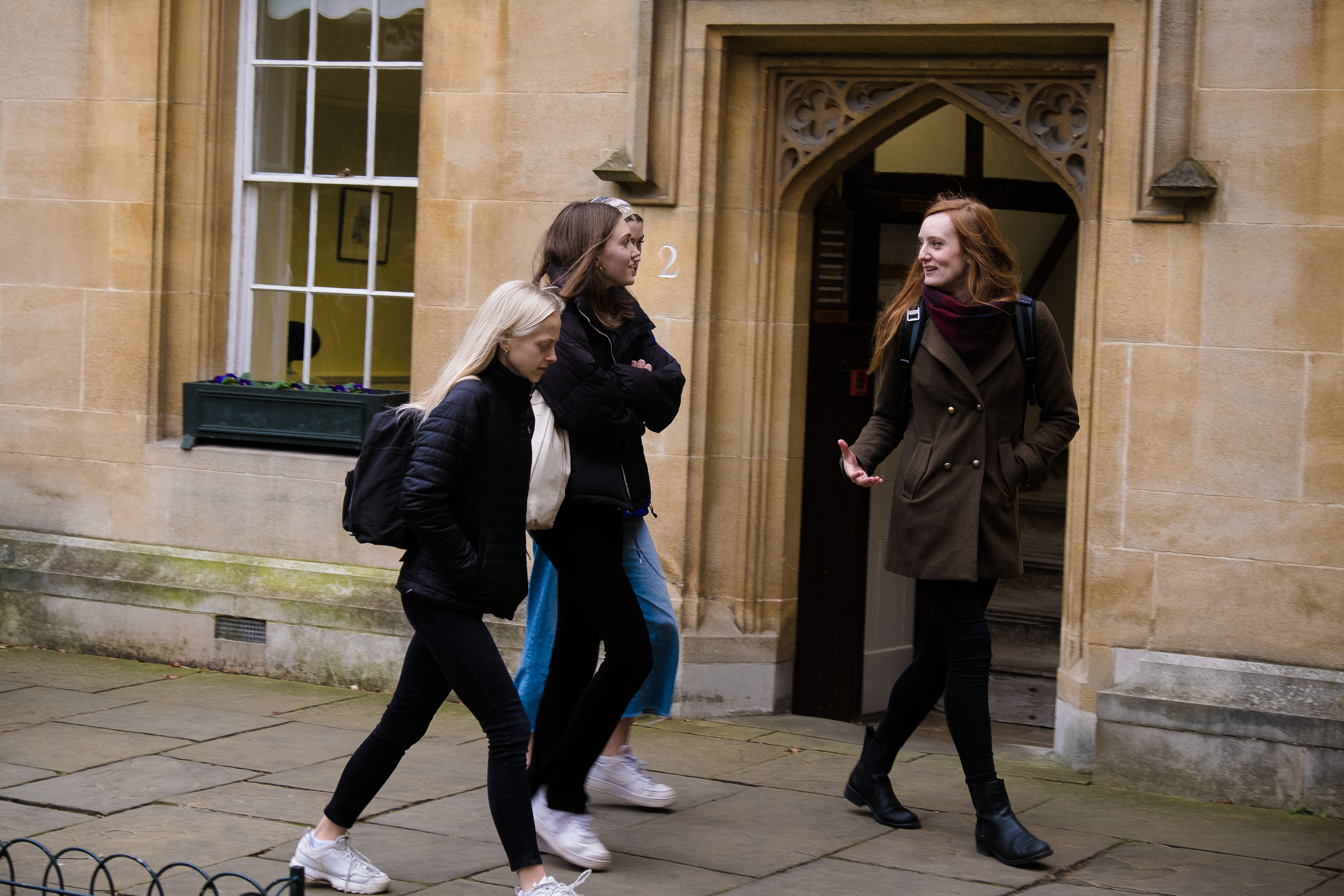 Outreach officer, Katie, talking to a group of prospective students in Lincoln College.