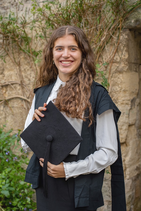 A photograph of Law student Bea on her matriculation day, wearing academic dress