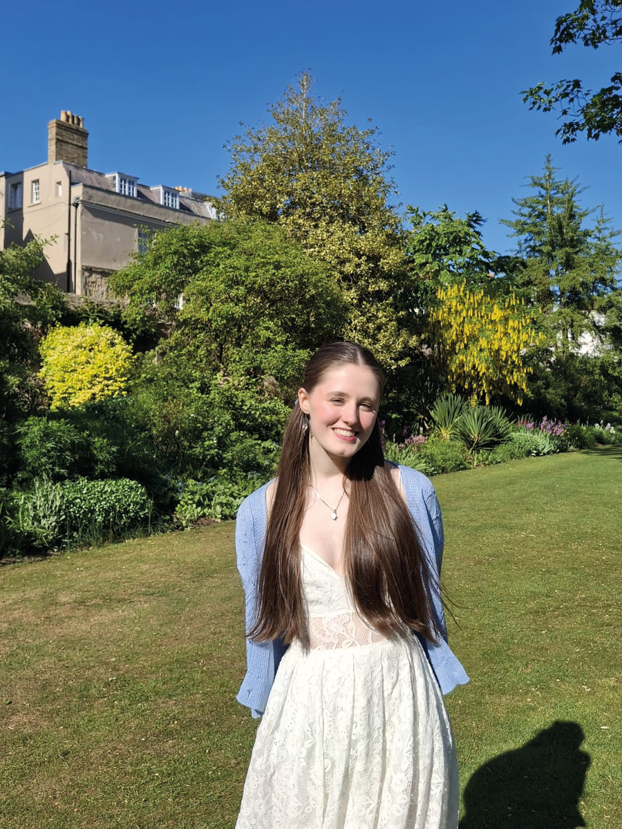 Oxford student in a college garden
