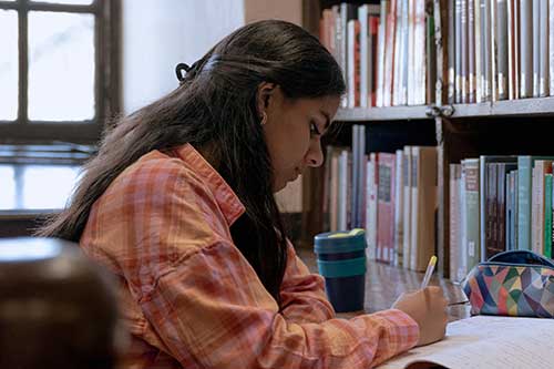 A student studying in the library