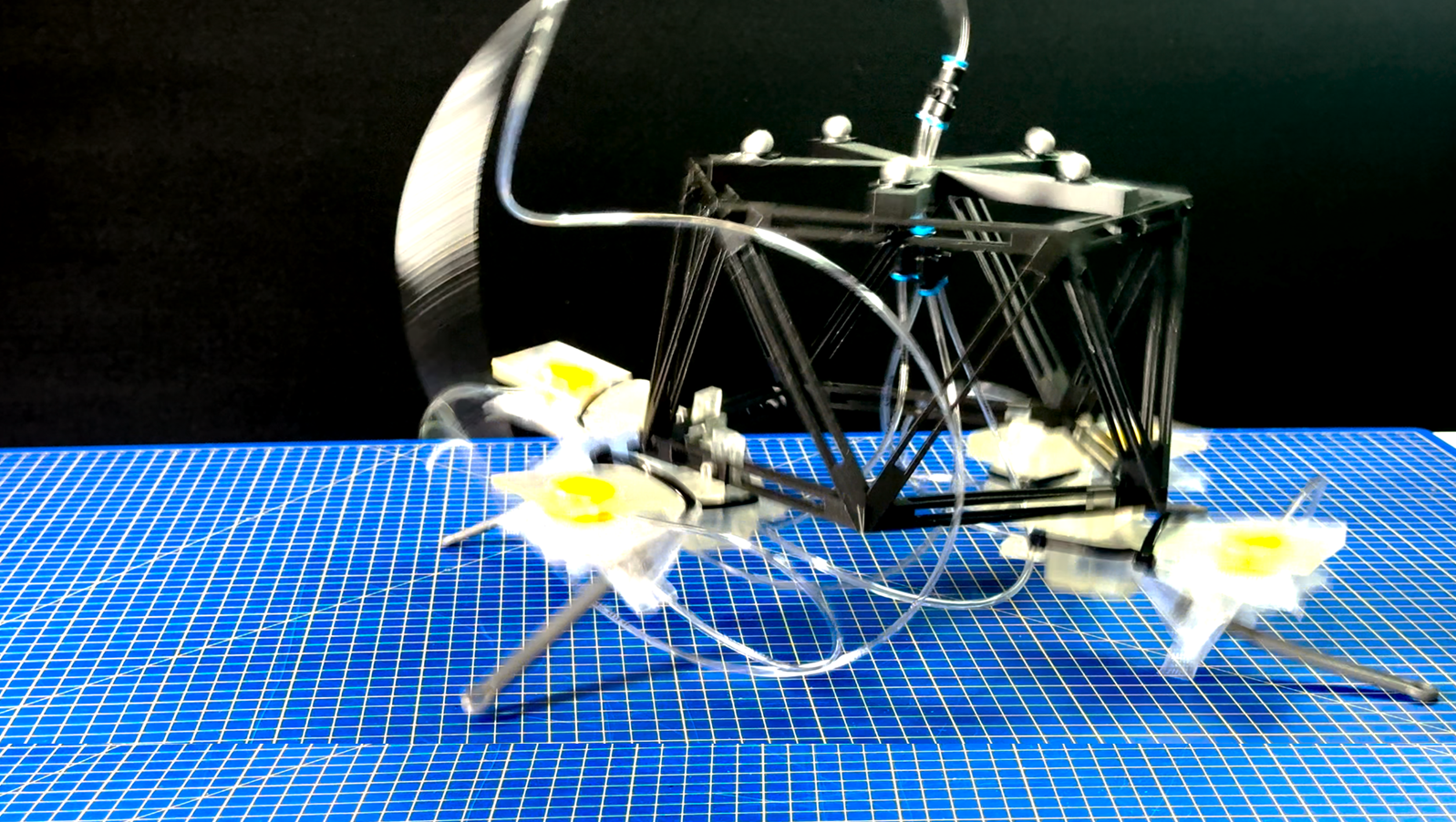 Researchers develop air-powered robots that move in sync without electronics