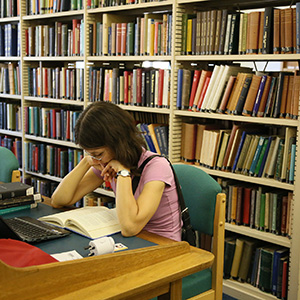 student studying in a library