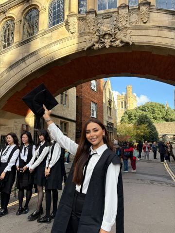 Oxford graduate Shabnam Taghiyeva in sub fusc by the Bridge of Sighs