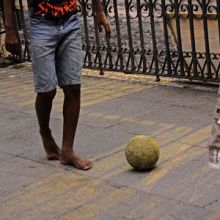 Children in Brazil playing football in the street