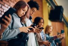 Teenagers on mobile phones. Credit: Drazen Zigic, Getty Images