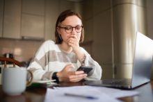 Woman reviewing financial documents