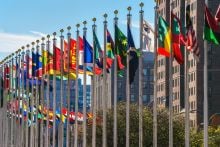 Flags of nations outside of the UN building in Manhattan. Credit: andykazie, Getty Images 