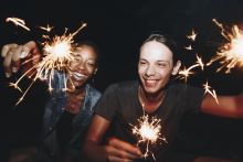 Two students holding sparklers
