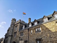 Merton College rainbow flag against blue sky