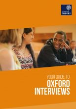 Front cover of the interviews guide. Three students sat at a desk talking. The background is orange.