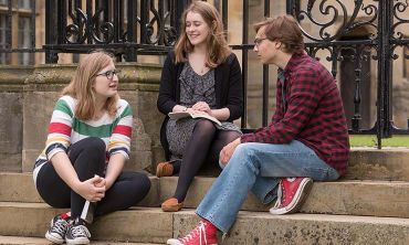 Students sat on the steps of Merton College