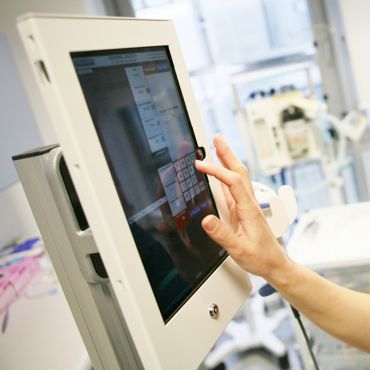 A member of staff at Oxford University Hospitals NHS Foundation Trust using a SEND tablet