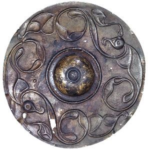 The Wandsworth Shield recovered from the Thames (British Museum) and a wooden roundel from Tuetka I, Altai Republic, Russian Federation (State Hermitage Museum, St Petersburg) date from Iron Age. 