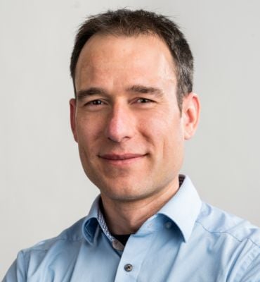 Portrait of Professor Moritz Riede, a white man with short dark hair.