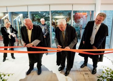 Image of ribbon being cut by Alastair Locke (left) and Lord Patten at official opening of Wadham's new Back Quad 