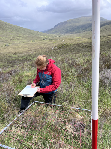 Dr Emily Warner measuring biodiversity 
