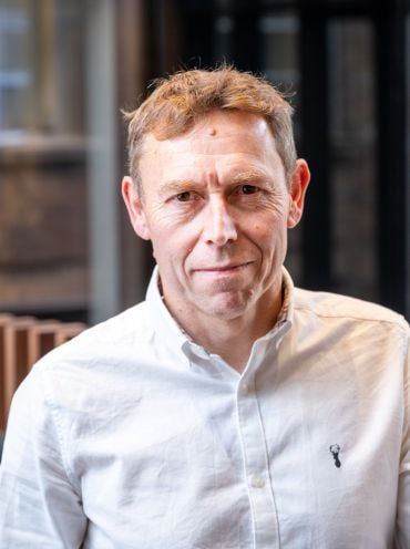 Professor Stephen Smartt, a white man with short brown hair wearing a cream-coloured shirt.