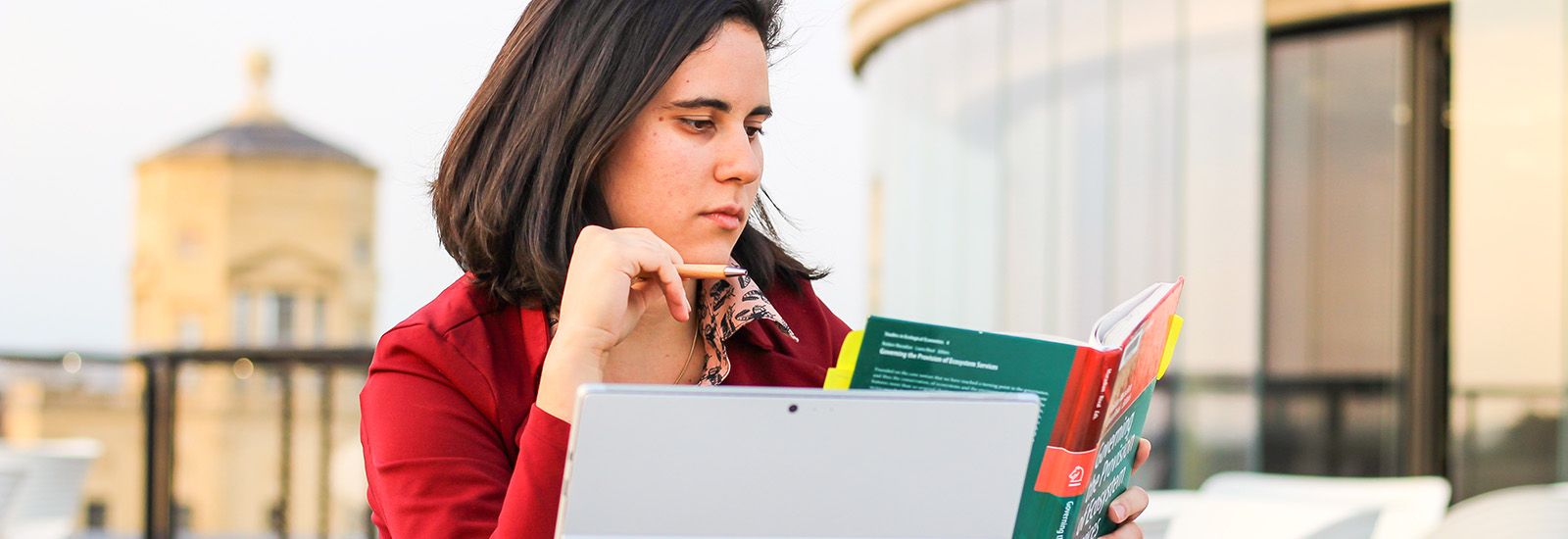Student with Green Templeton College in background