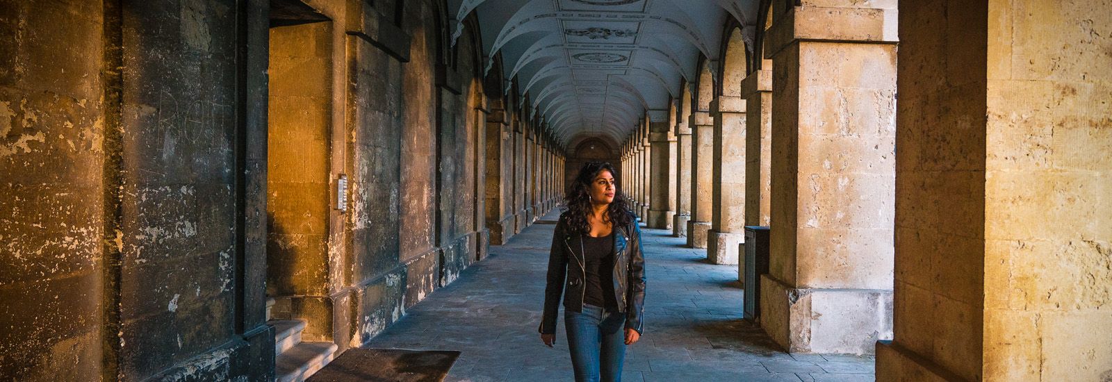 A student walking through Magdalen College