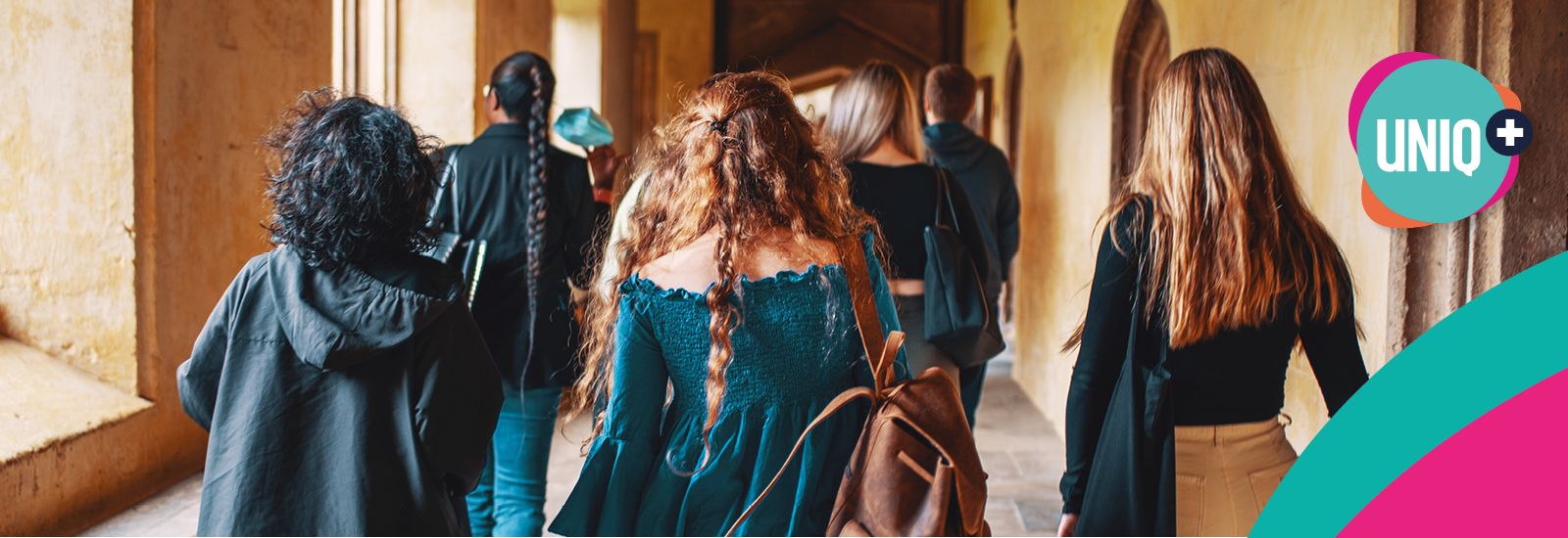 Students walking in a cloister