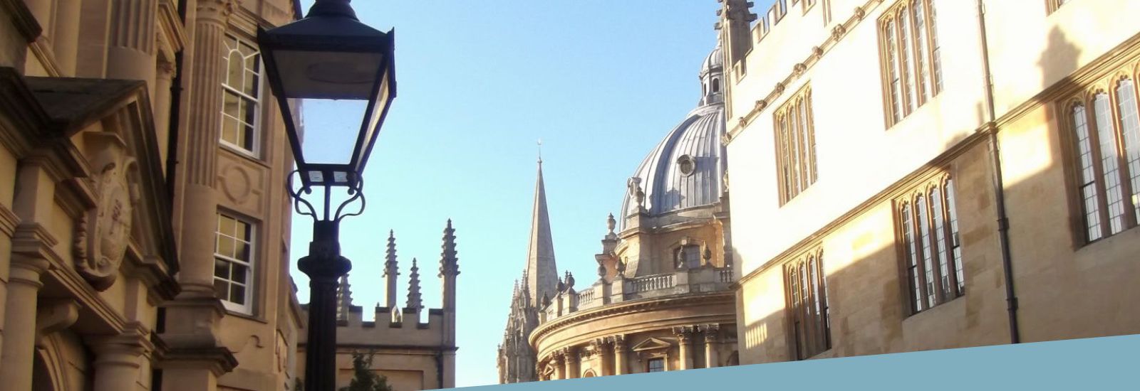 Looking down Catte Street with Hertford college on the left, the domed top of the Radcliffe Camera library in the centre and the Bodleain library on the right.