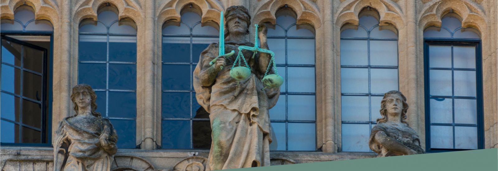 Detail of the façade of the Bodleian Library in Oxford showing Justice with her scales and blindfold.