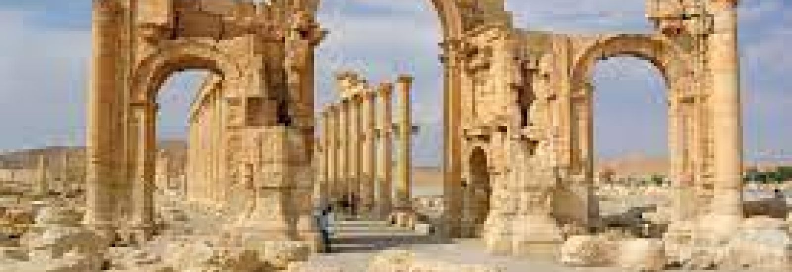 The arched ruins of ancient Palmyra, in the Syrian desert.