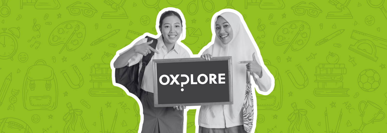 2 girls holding an Oxplore sign