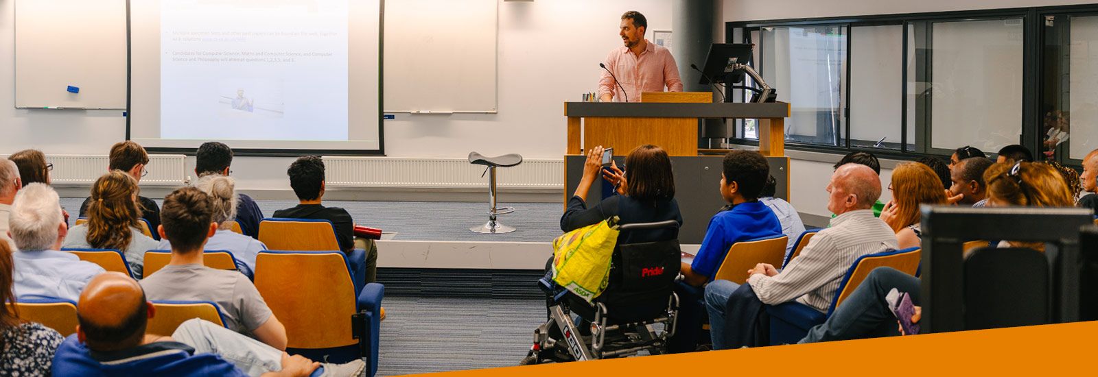 University lecturer speaking to Open Day attendees
