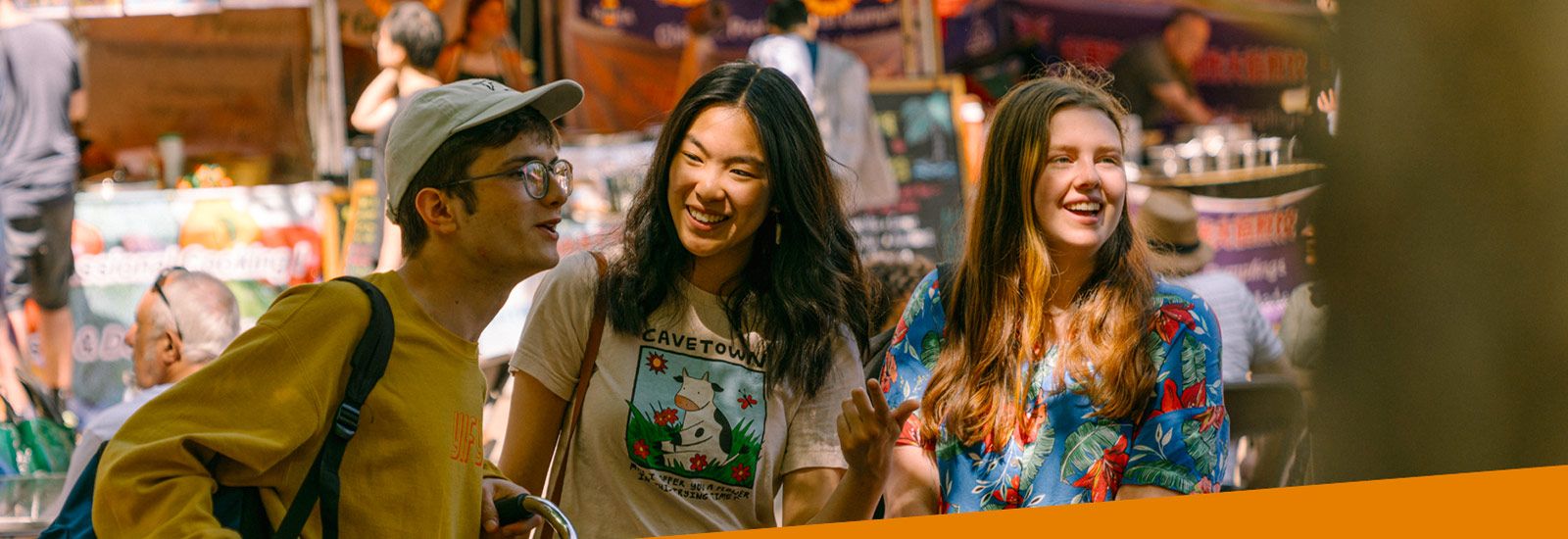Three students in a market