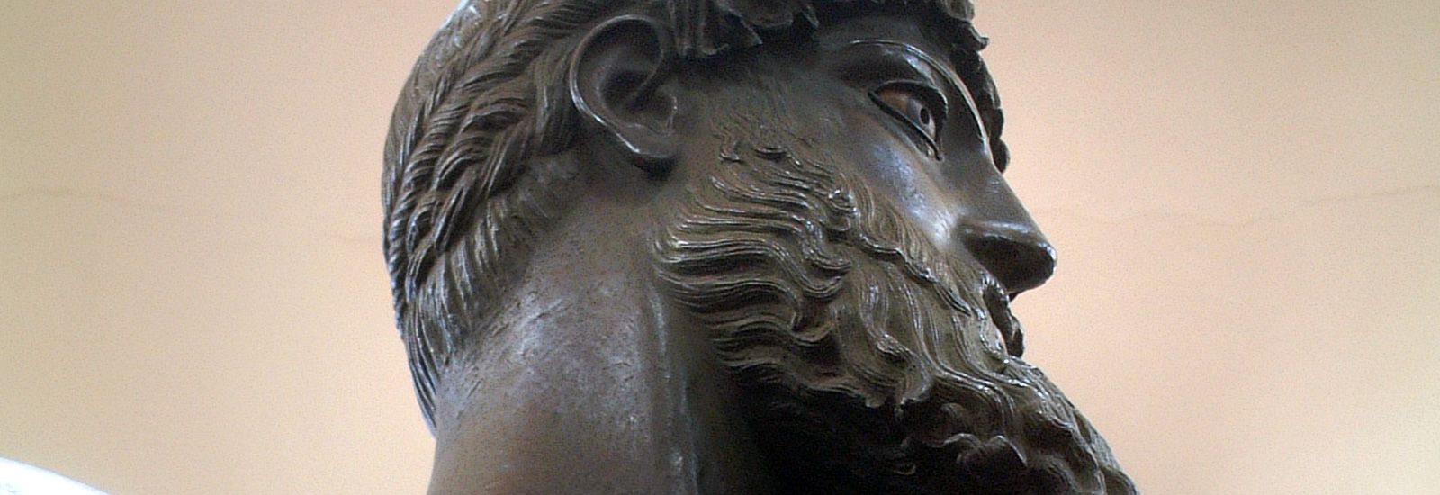 Close up of the head of a bronze statue