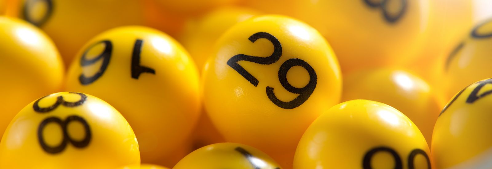 Background of yellow balls with bingo numbers used to randomly select lucky numbers during a bingo game
