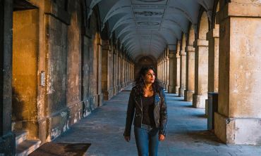 A student walking through Magdalen College