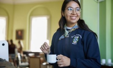 A student with a hot drink at Green Templeton College