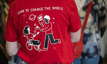 Learn to change the World volunteer t-shirt for Open Day