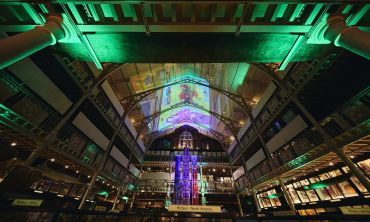 Image depicts displays in the Pitt Rivers Museum lit up at night