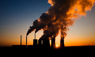 coal fired power station silhouette at sunset