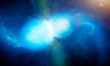 Two neutron stars (as luminous orbs) merging together, with a vertical jet produced between them.