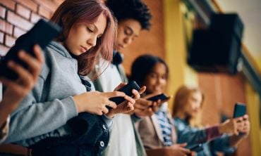 Teenagers on mobile phones. Credit: Drazen Zigic, Getty Images
