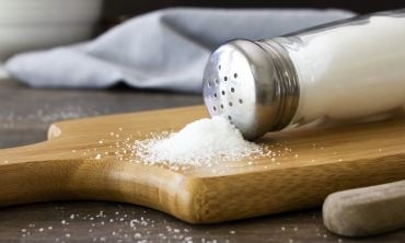Salt on wooden chopping board