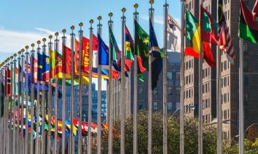 Flags of nations outside of the UN building in Manhattan. Credit: andykazie, Getty Images 