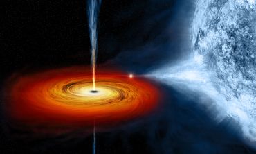 Artistic image showing matter being dragged from a star to form a spiral shaped rotating mass around a black hole. 