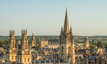 The Oxford skyline at sunset, showing All Souls College and the University Church in the foreground