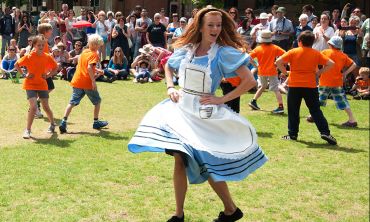 Alice dancing with children