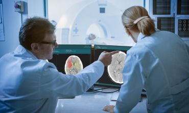 Brainomix scientists analysing brain scan