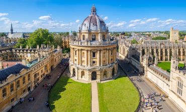 An aerial image of the Radcliffe Camera, an ornate cylindrical building in Oxford topped with a dome. Image credit: Shutterstock.