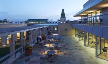 External photo of Said Business School at dusk