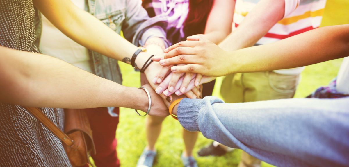 Generic charity image of hands on top of one another