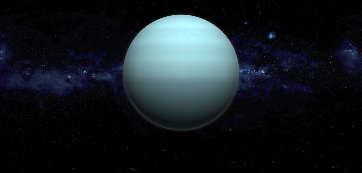 The planet Uranus, seen as a greenish-blue sphere, is suspended in outer space against an illuminated line of stars to represent the Milky Way Galaxy.