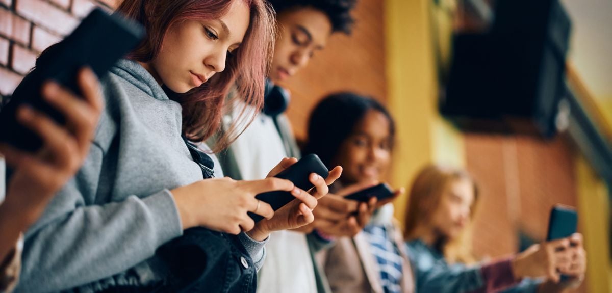 Teenagers on mobile phones. Credit: Drazen Zigic, Getty Images